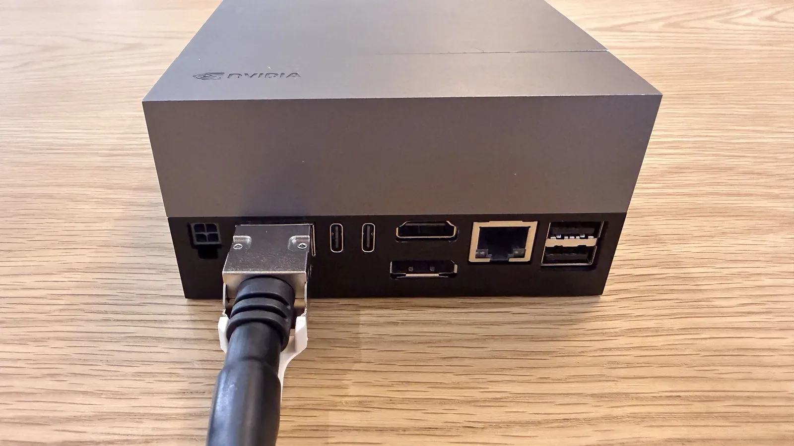 QSFP+ end of the breakout cable connected to the Jetson AGX Thor Developer Kit