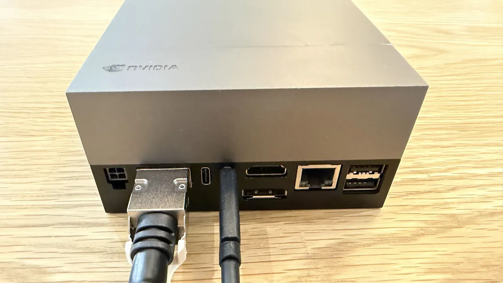 QSFP+ data cable and USB-C power cable connected to the Jetson AGX Thor Developer Kit