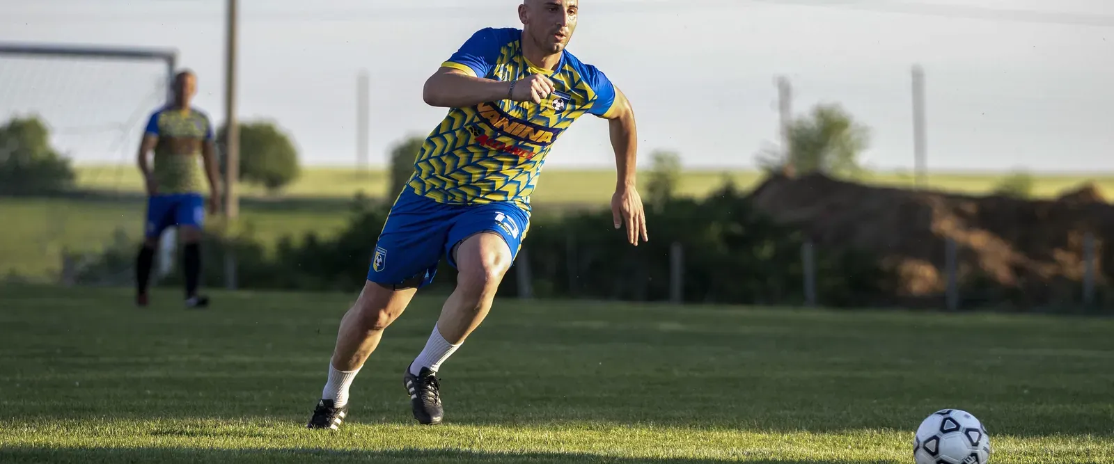Soccer player running with the ball
